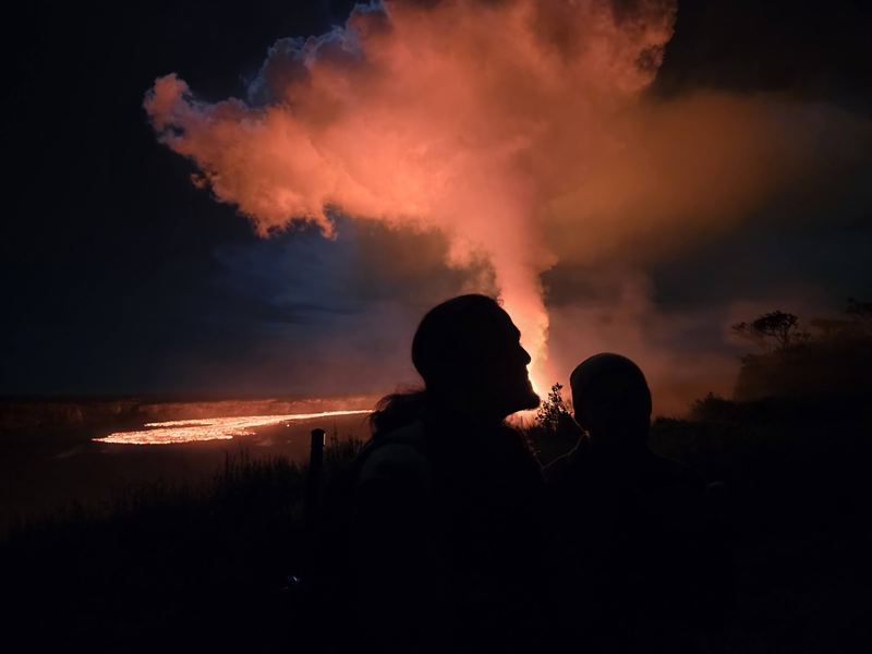 Jessie silhouette watching the eruption