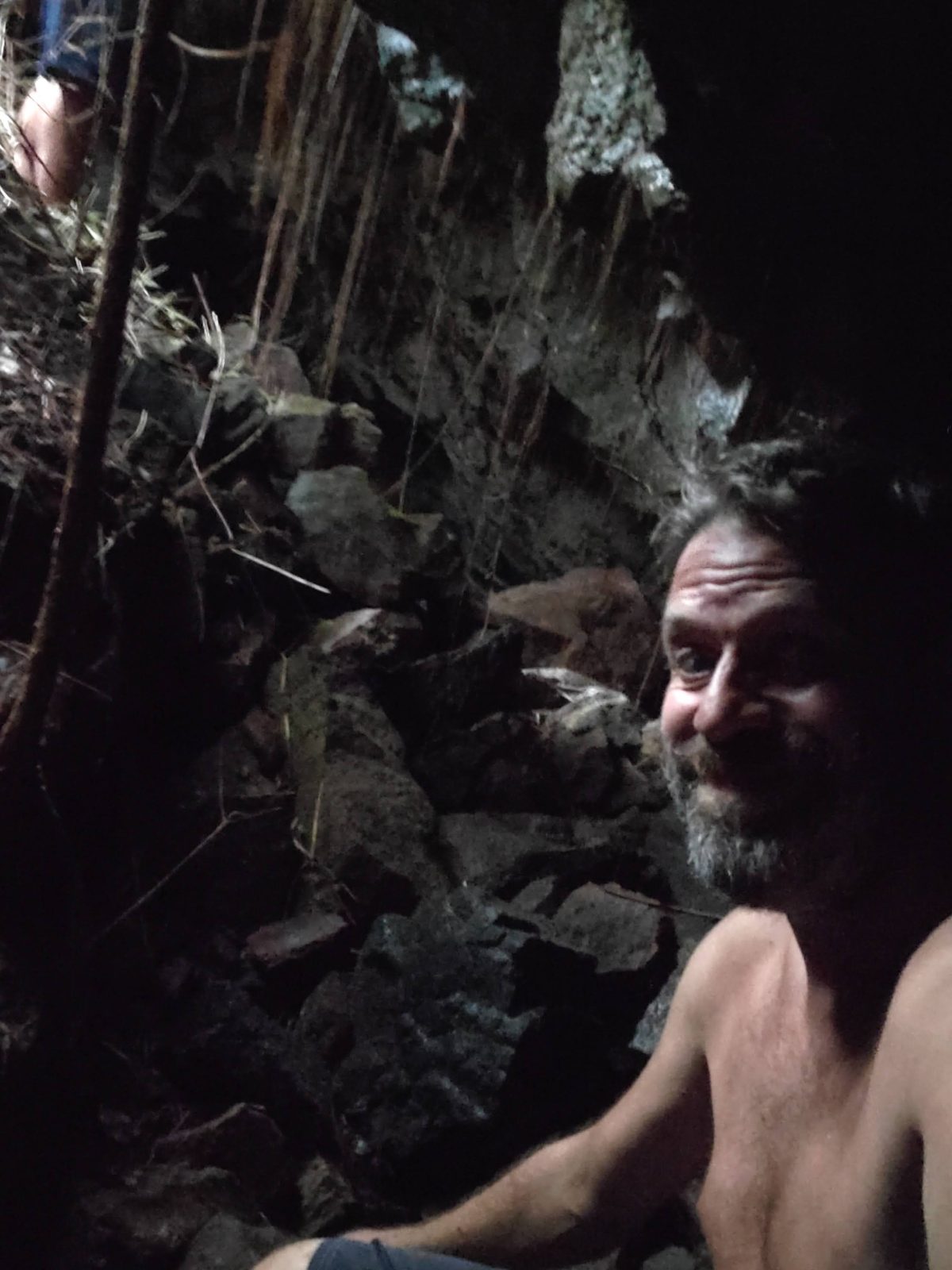 Jessie selfie inside the lava tube with hanging roots