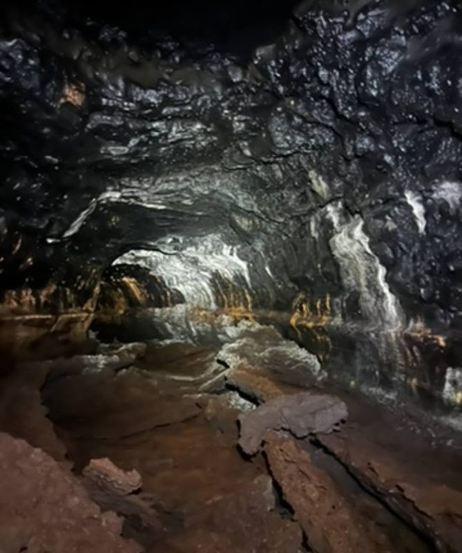 Mineral banding on lava tube walls under Mountain View